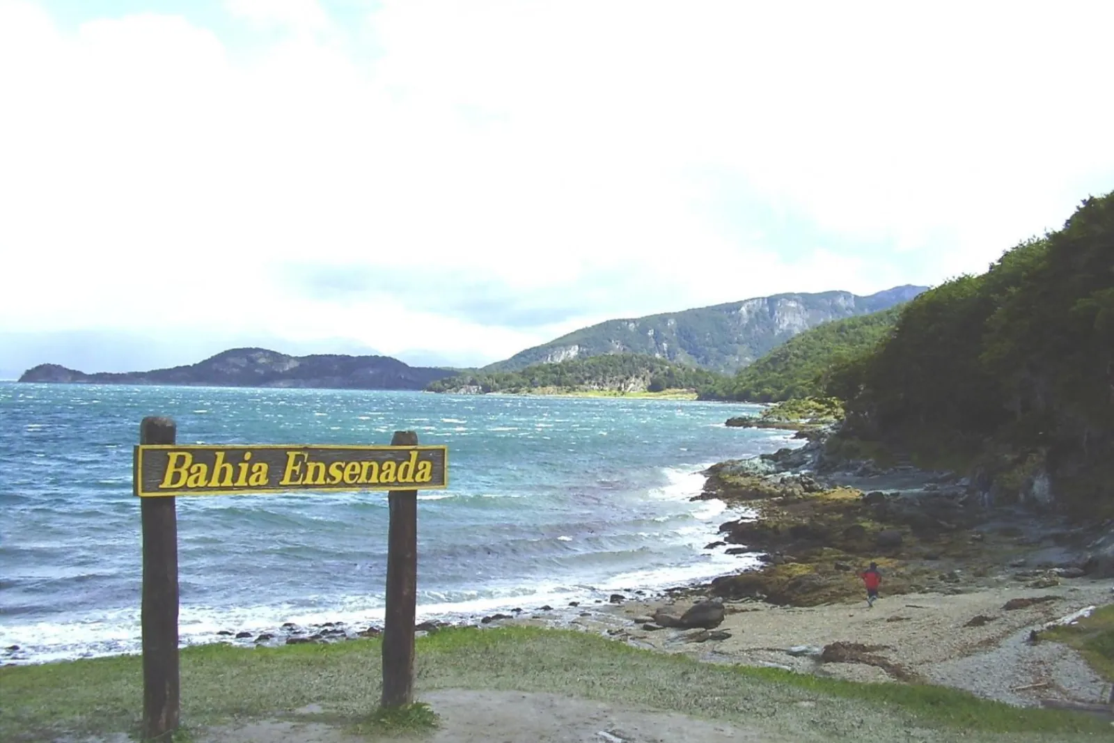 Bahía Ensenada sign on the shore of the Beagle Channel